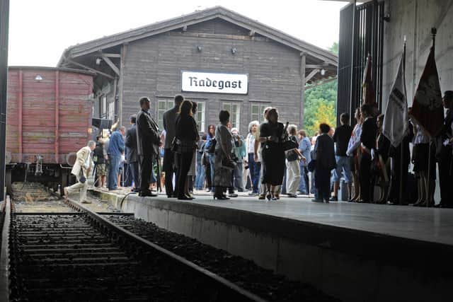 People pay homage to 220,000 Jews who perished in the Lodz ghetto during World War II, 65 years after its liquidation by German Nazis at the Radegast train station, serving as a loading point for about 145 000 Jews deported by Germans to death camps. (Photo: JANEK SKARZYNSKI/AFP via Getty Images)