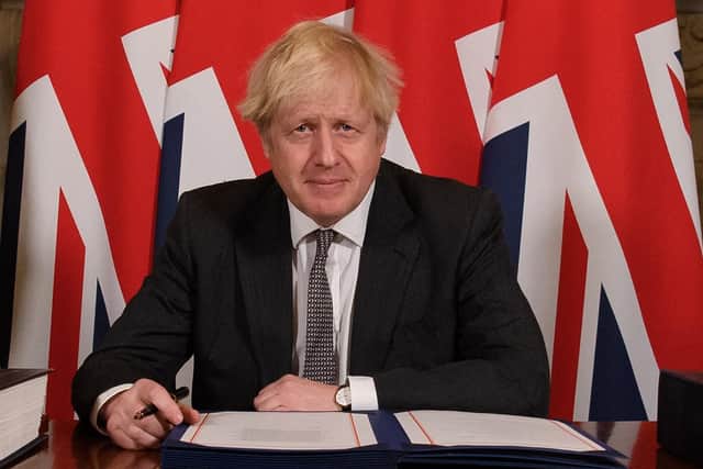 This was Boris Johnson signing his Brexit deal with the EU last December.