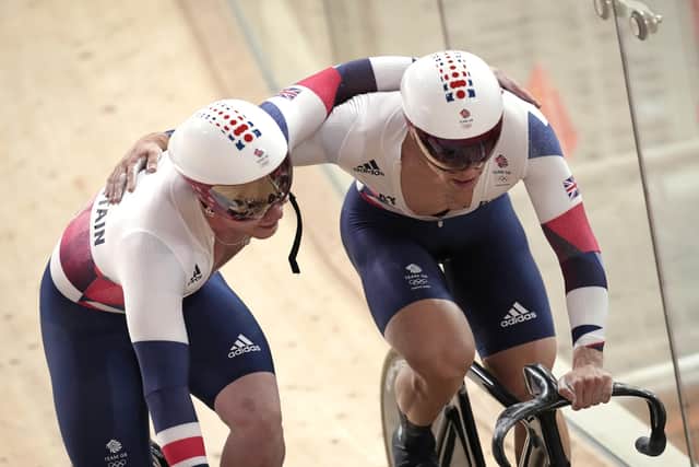 Well done: Ryan Owens and Jack Carlin hug after winning the silver medal during the track cycling men's team sprint in Izu, Japan.