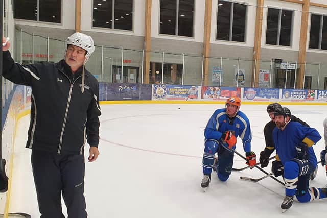 PLEASED TO MEET YOU: Dave Whistle goes through a drill with his Leeds Knights' players at Elland Road ice rink.