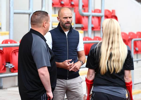 Rotherham United manager Paul Warne with fans Kerry Coleman and James Bradshaw. Picture: Matt West/Shutterstock/EFL