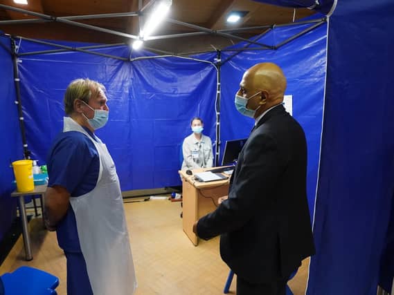 Health Secretary Sajid Javid talking to staff during a visit to the Bournemouth Vaccination Centre, in Bournemouth, Dorset. (PA/Steve Parsons)