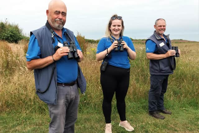 Staff try out the new binoculars