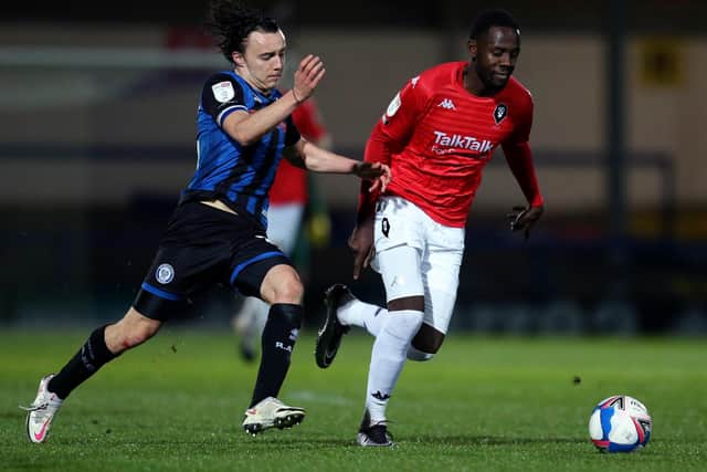 Midfielder Ollie Rathbone, seen in action for Rochdale, left, has joined Rotherham United, where manager Paul Warne has long been an admirer. Picture: Lewis Storey/Getty Images