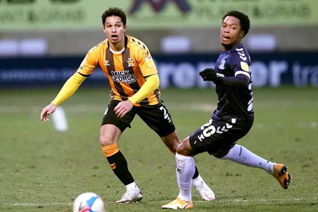New Doncaster signing Kyle Knoyle (left) playing for Cambridge United.