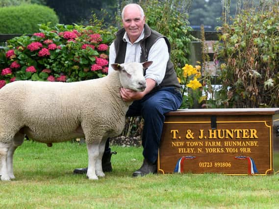 Thomas Hunter with one of his champion sheep