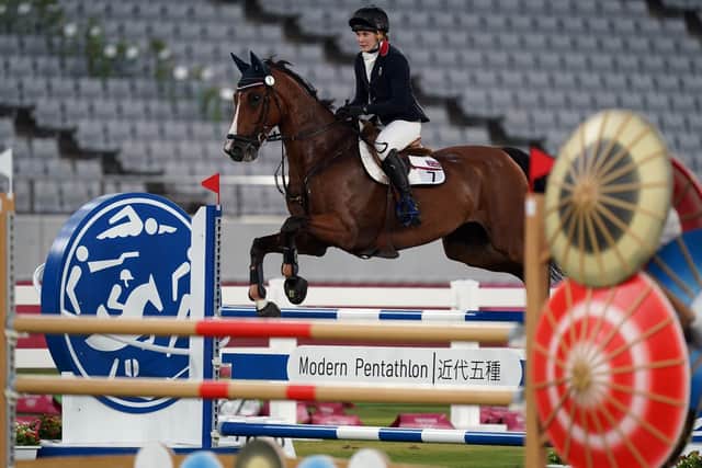 Riding to gold: Great Britain's Kate French during the show-jumping section.