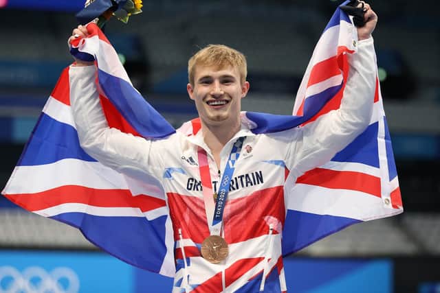 Great Britain's Jack Laugher celebrates on the podium with the bronze medal for the Men's 3m Springboard at Tokyo Aquatics Centre on the eleventh day of the Tokyo 2020 Olympic Games in Japan. Picture: Martin Rickett/PA Wire
