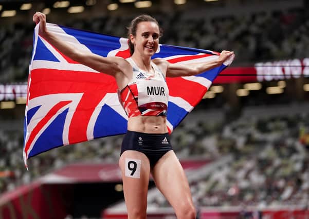Flying the flag: Great Britain's Laura Muir celebrates after winning the silver medal in the women's 1500m final.