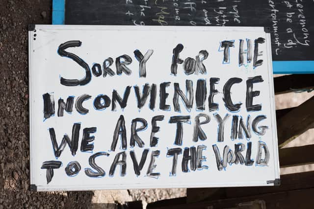 A protest sign at a fracking site.