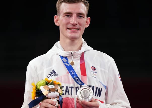 Silver success: Doncaster's Bradly Sinden with his silver medal after losing to Uzbekistan's Ulugbek Rashitov.