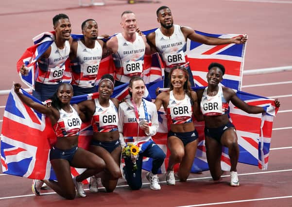 Great Britain's (back row, left-right) Zharnel Hughes, Chijindu Ujah, Richard Kilty, Nethaneel Mitchell-Blake, (front row, left-right)  Dina Asher-Smith, Asha Philip, Laura Muir,Imani-Lara Lansiquot and Daryll Neita with their medals  at the Olympic Stadium (Picture: PA)