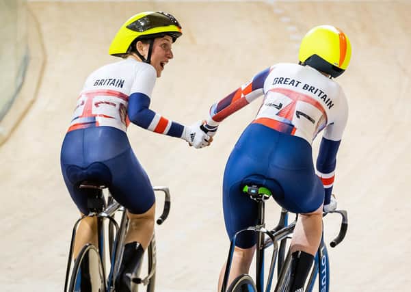 We did it: Laura Kenny, left, looks towards her team-mate Kate Archibald in delight after Great Britain won gold in track cycling’s madison, a fifth gold of Kenny’s Olympic career. (Picture: Alex Whitehead/SWPix.com)