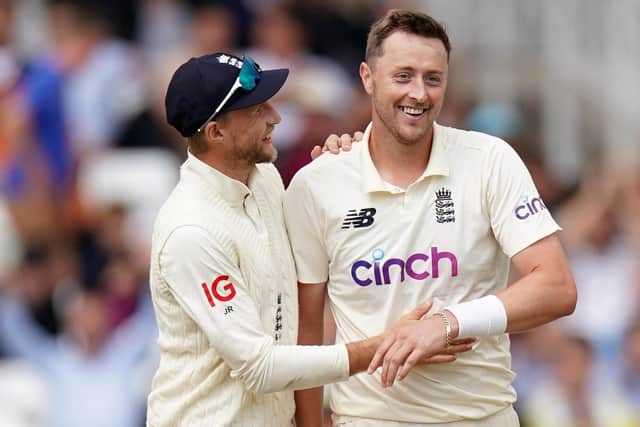 England's Ollie Robinson (right) celebrates the wicket of India's Jasprit Bumrah and his 5fer with captain Joe Root (Picture: PA)