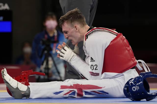 Britain's Bradly Sinden reacts after defeated for the gold medal for the taekwondo men's 68kg match at the 2020 Summer Olympics. (AP Photo/Themba Hadebe)