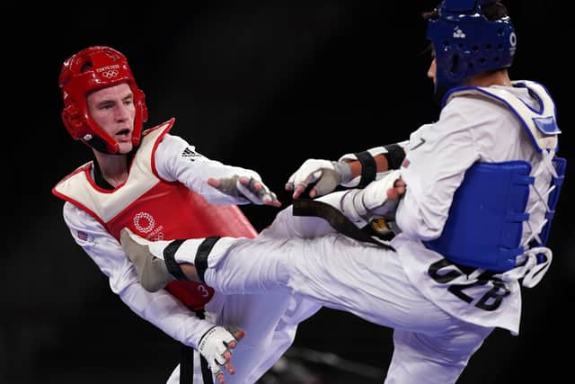 Great Britain's Bradly Sinden (left) in action against Uzbekistan's Ulugbek Rashitov in the Men's 68kg Gold Medal Contest at Makuhari Messe Hall A on the second day of the Tokyo 2020 Olympic Games in Japan. (Picture: Mike Egerton/PA Wire)