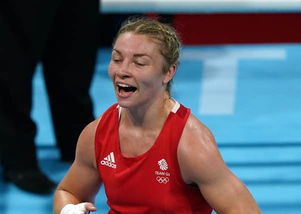 Champion: Great Britain's Lauren Price celebrates defeating China's Qian Li at the Kokugikan Arena.