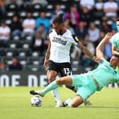 Timely tackle: Derby County's Colin Kazim-Richards is challenged by Huddersfield Town's Matthew Pearson.