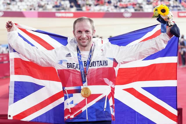 Great Britain's Jason Kenny celebrates with the gold medal in the Men's Keirin Finals to become the first Team GB athlete to win seven Olympic gold medals.