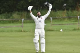 Century salute: North Leeds' Amir Farooq celebrates his century at  Horsforth in Division One of the Aire Wharfe League. He scored 106 off 71 balls including eight fours and seven sixes. Picture: Steve Riding