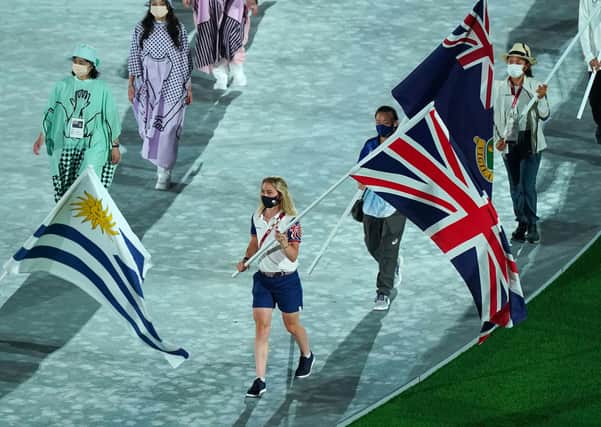 Great Britain's Laura Kenny carrying the Union Jack flag during the closing ceremony of the Tokyo 2020 Olympic Games at the Olympic stadium in Japan.