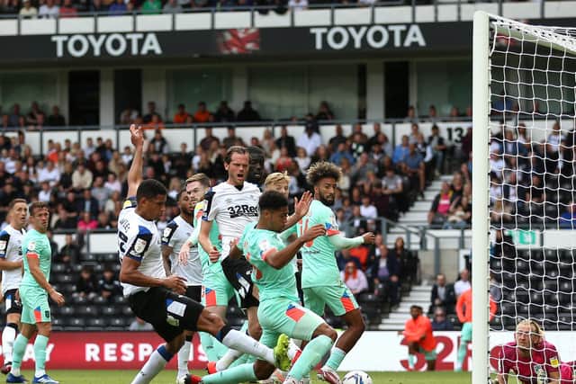 OPENER: The ball is bundled in by Derby County. Picture: PA Wire.