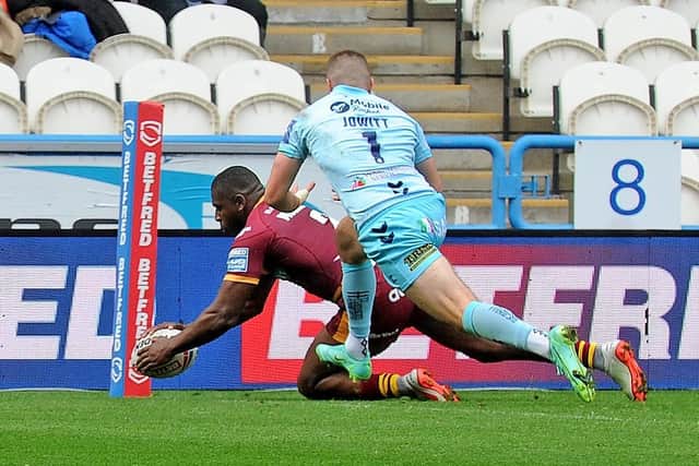 Jermaine McGillvary scores for Huddersfield. Picture: Steve Riding