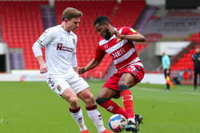 DOUBT: Doncaster Rovers' Cameron John (right) has a sore back