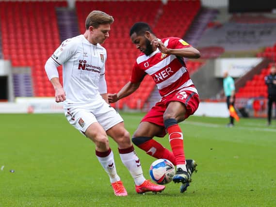 DOUBT: Doncaster Rovers' Cameron John (right) has a sore back