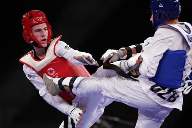 Bradly Sinden (left) in action against Uzbekistan's Ulugbek Rashitov in the Men's 68kg Gold Medal Contest at Makuhari Messe Hall A on the second day of the Tokyo 2020 Olympic Games in Japan. Picture: Mike Egerton/PA Wire.
