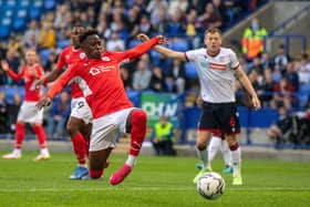 Disappointing: Barnsley striker Clarke Oduor gets a shot in against Bolton Wanderers.  Pictures: Bruce Rollinson