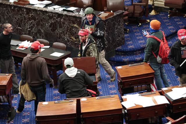 Protesters enter the Senate Chamber on January 06, 2021 in Washington, DC. Congress held a joint session today to ratify President-elect Joe Biden's 306-232 Electoral College win over President Donald Trump. Pro-Trump protesters have entered the U.S. Capitol building after mass demonstrations in the nation's capital.
