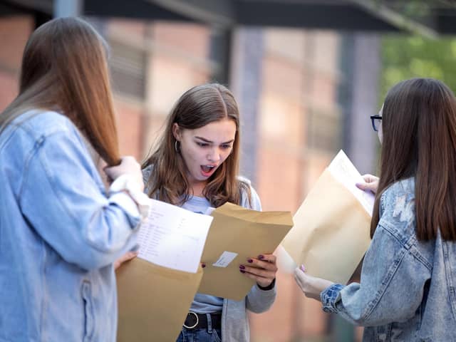 File photo dated 22/08/19 of students opening their GCSE results at Robert May's School in Odiham, Hampshire (PA/Victoria Jones)