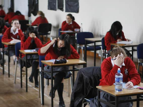 Undated file photo of students sitting an exam (PA/Niall Carson)