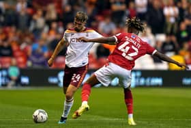 Nottingham Forest's Ateef Konate and Bradford City's Finn Cousin-Dawson battle for the ball. Pictures: PA