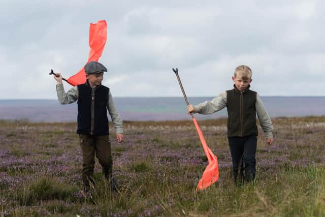 Young beaters help on the first day of the grouse season in North Yorkshire. Image by photographer Jonathan Pow.