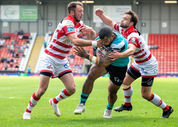 Tough going: Manu Ma'u pushes through for Hull's third try against bottom club 
Leigh Centurions.  Picture: Bruce Rollinson