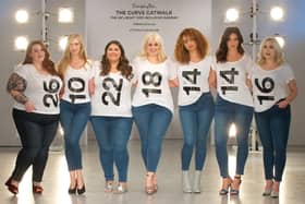 Models display their dress sizes on the  2017 Curve catwalk for Simply Be.