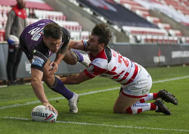 In the corner: Leeds' Tom Briscoe scores his side's second try against Leigh. Picture by Paul Currie/SWpix.com