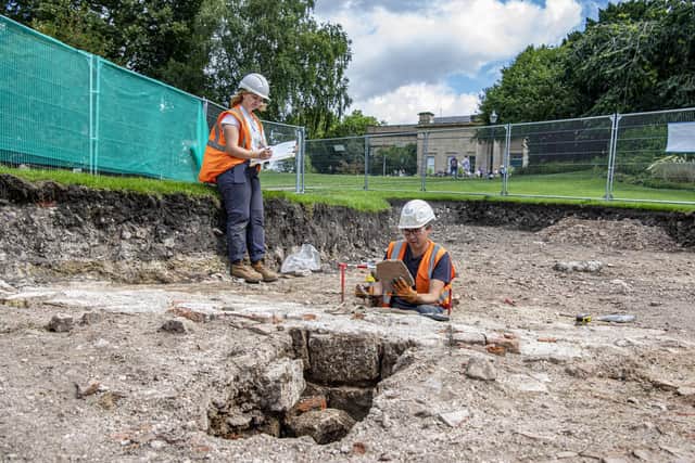 York Archaeological Trust staff George Loffman and Fran Birtles examine the trench