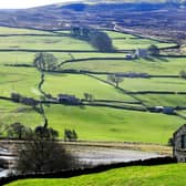 A traditional stone barn is pictured in the foreground near Reeth, in the Yorkshire Dales National Park. The Yorkshire Dales National Park Authority is launching a consultation on its policies for converting barns into homes. (Photo: Gary Longbottom)