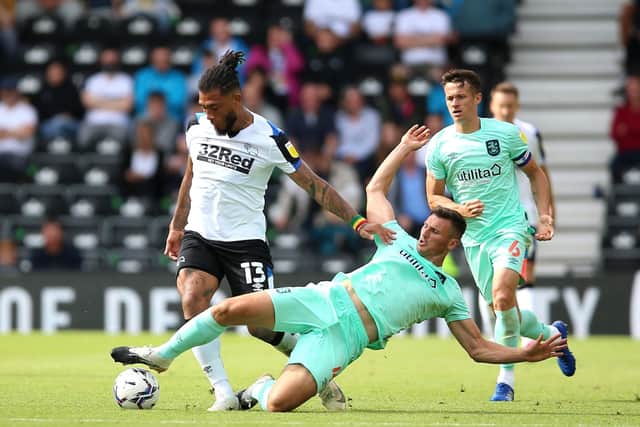 Derby County's Colin Kazim-Richards (left) and Huddersfield Town's Matthew Pearson battle for the ball during the Sky Bet Championship opener last week (Picture: PA)