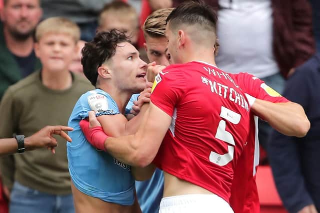 Coventry City's Callum O'Hare (left) and Barnsley's Liam Kitching clash during the Sky Bet Championship match at Oakwell (Picture: Richard Sellers/PA Wire)