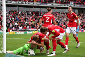 Barnsley goalkeeper Bradley Collins celebrates with team-mates after saving Coventry City's Viktor Gyokeres (not pictured) penalty kick (Picture: PA)