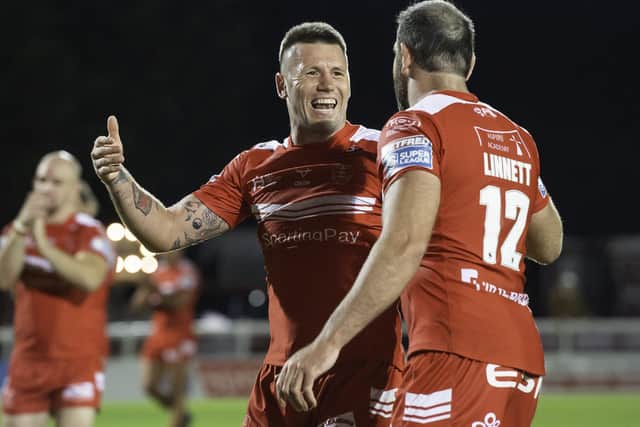 Hull KR's Shaun Kenny-Dowall celebrates victory over Wigan with Kane Linnett. Picture: Alan McKenzie/SWpix.com