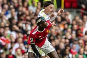 TUSSLE: Robin Koch competes for the ball with Paul Pogba