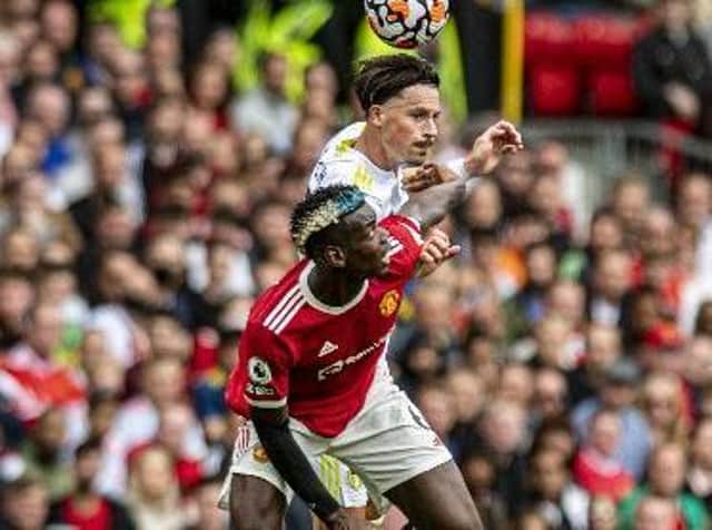 TUSSLE: Robin Koch competes for the ball with Paul Pogba