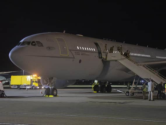The first flight of evacuated personnel arriving at RAF Brize Norton in the UK