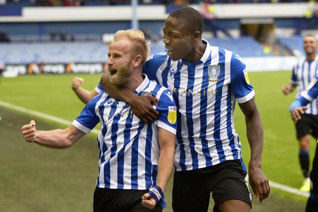 One-two: Owls captain Barry Bannan celebrates after opening the scoring against Doncaster Rovers with Dennis Adeniran - who added the second. Picture: Steve Ellis
