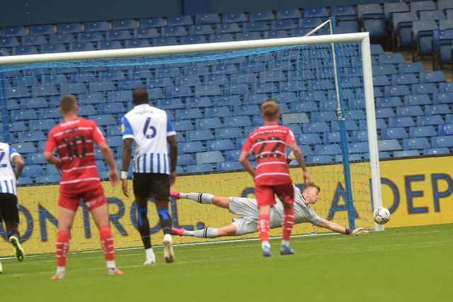 Denied: Owls keeper Bailey Peacock-Farrell saves a penalty by the unsighted Omar Bogle. Picture: Steve Ellis